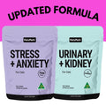 The Stress Less Bundle, featuring two PetzPark cat supplement pouches—Stress + Anxiety and Urinary + Kidney—is displayed against a pink background with the text UPDATED FORMULA above them, highlighting targeted anxiety relief and urinary tract support for your feline friend.