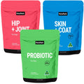 Three bags from the PetzPark Total Health Package for Dogs—pink (Hip + Joint), blue (Skin + Coat), and green (Probiotic)—each clearly labeled with their contents, are designed to provide targeted joint support, gut health, and overall wellness for your canine companion.
