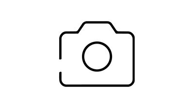 Simple black outline of a camera icon on a light gray background.