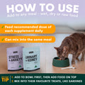 Cat eating from a bowl with pet supplement packages and instructions on how to use them.