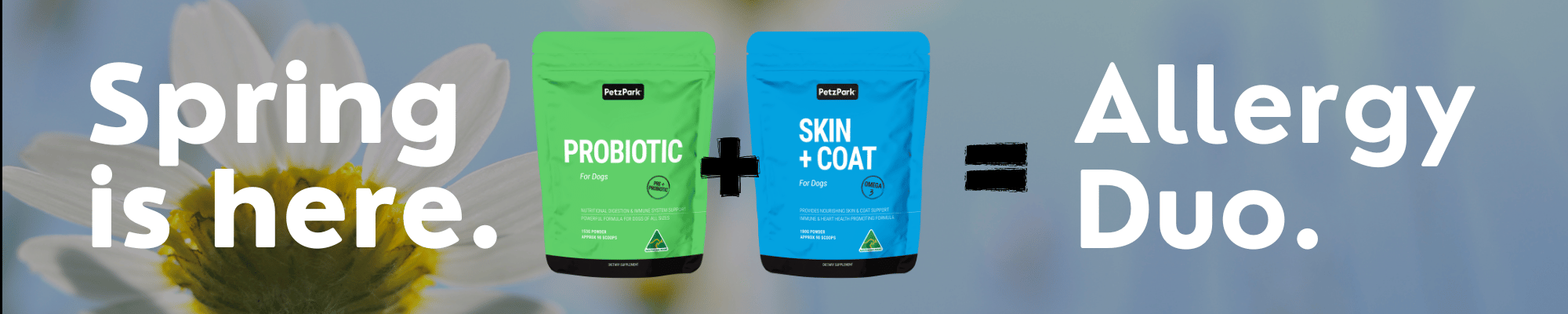 Two pet supplement bags labeled Probiotic and Skin + Coat with text: Spring is here. + = Allergy Duo. A large flower is blurred in the background.